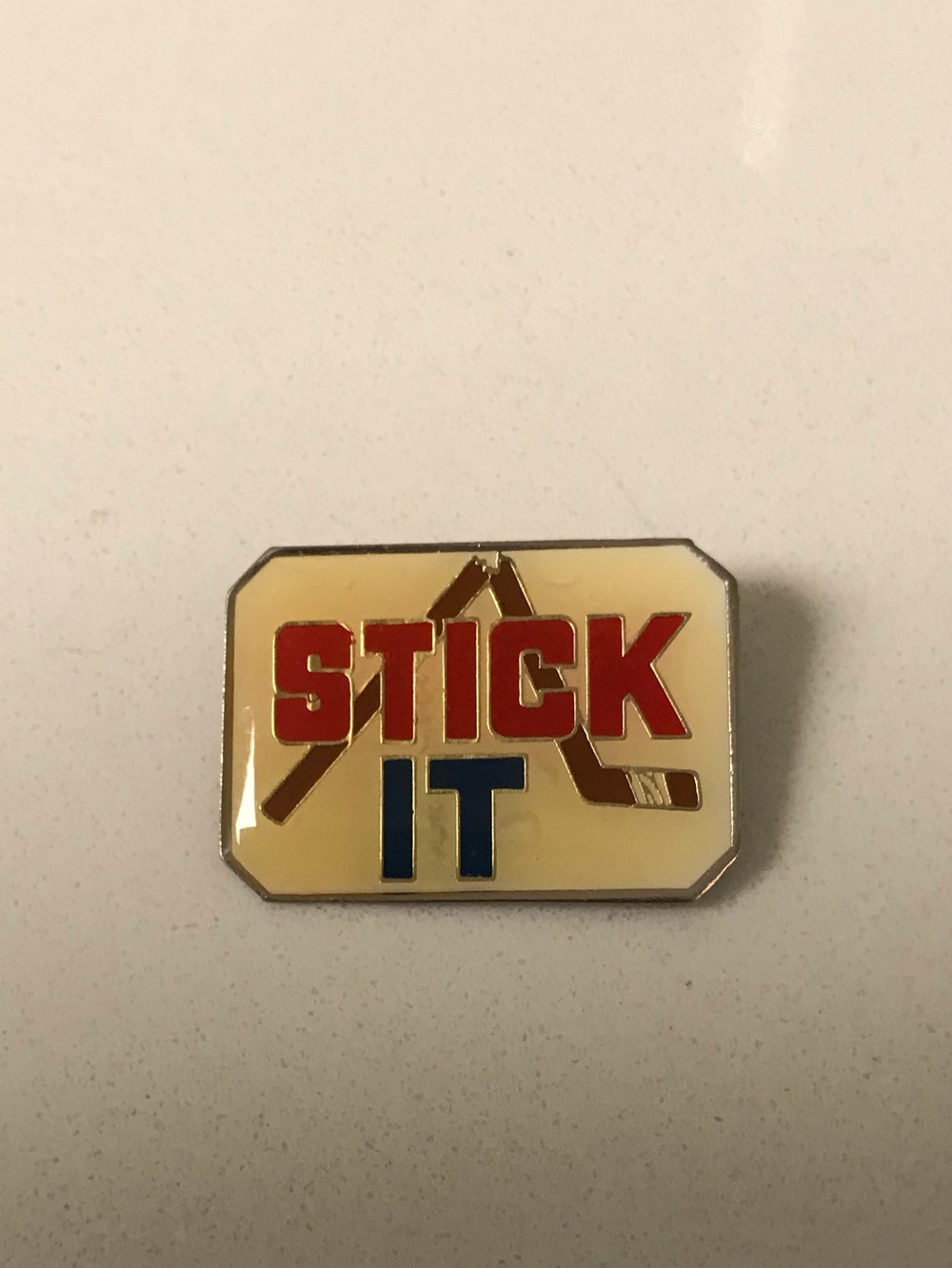 Enamel 'STICK IT' Hockey Pin - Cream, Red & Blue